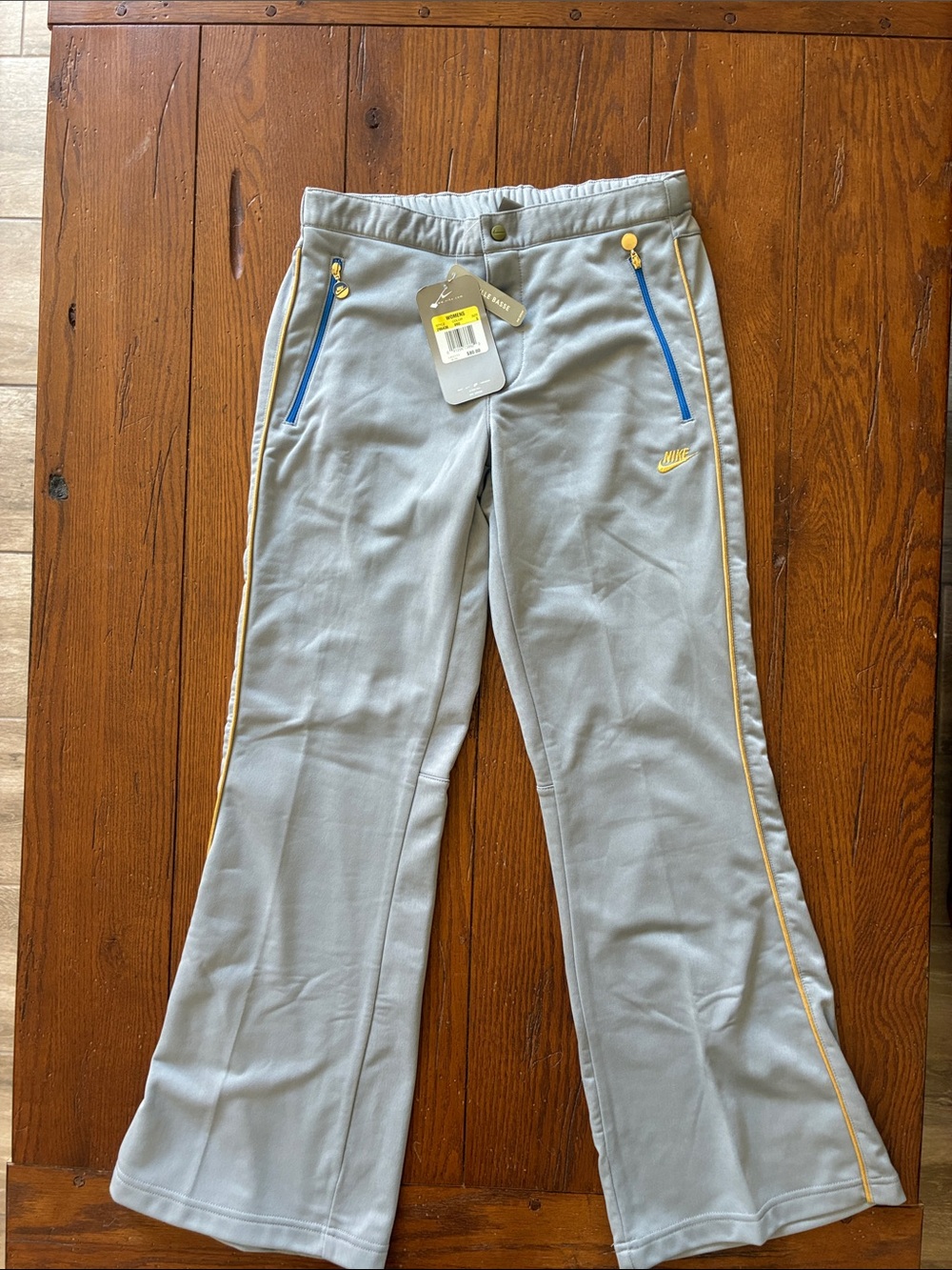 Retro Nike Gray Track Pants with Yellow Trim and Blue Zips